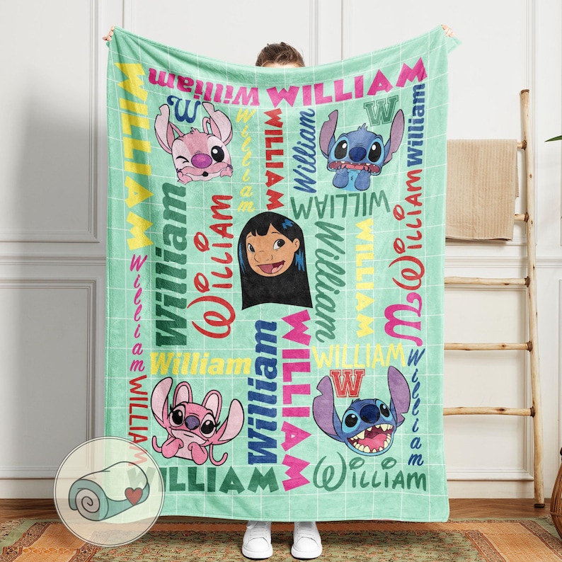May include: A mint green blanket featuring cartoon characters and the name "William" in various colors and fonts. The blanket has a grid pattern and includes images of a girl and two alien creatures.