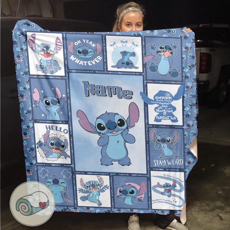 May include: A blue blanket featuring multiple images of the character Stitch from the Disney movie Lilo & Stitch. The blanket has a light blue background with various Stitch poses and phrases like "Oh Yeah Whatever" and "Stay Weird". The word "Name" is also visible.