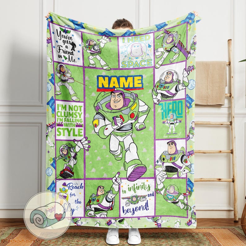 May include: A green and purple blanket featuring Buzz Lightyear from Toy Story. The blanket has a grid design with various images of Buzz, along with phrases like "You've got a friend in me" and "to infinity and beyond!"