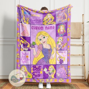 May include: A purple fleece blanket featuring a collage of images of a cartoon princess with long blonde hair. The blanket includes the text "custom name", "Best Day Ever", and other inspirational phrases. The blanket is approximately 60 inches by 50 inches.