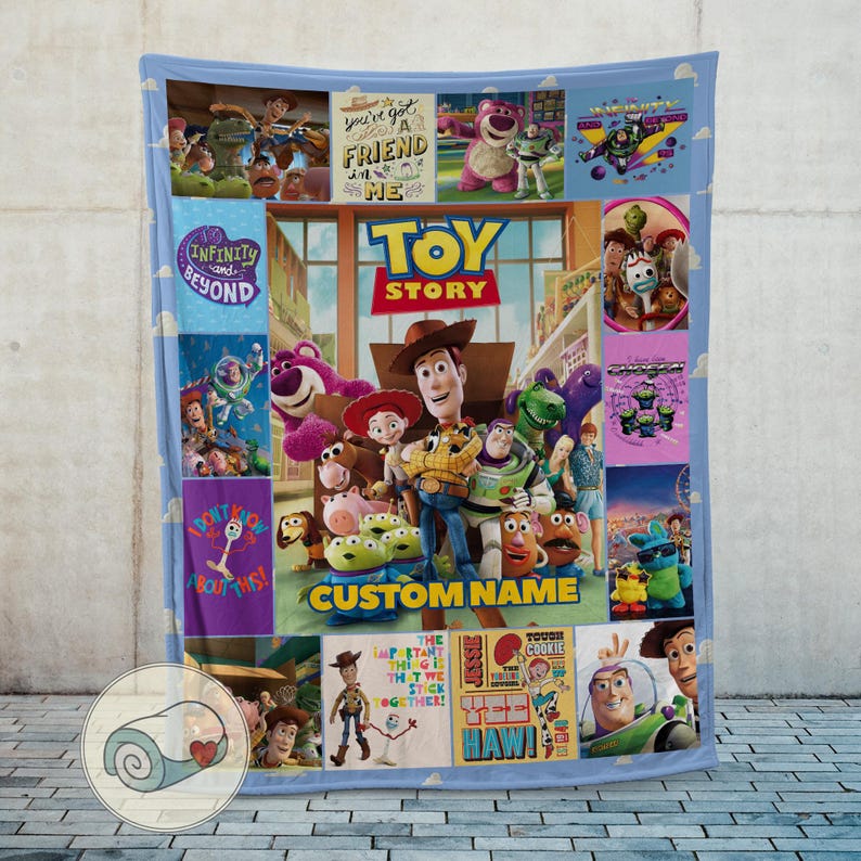 May include: A blue blanket with various characters and graphics from the film "Toy Story." The central image shows Woody, Buzz Lightyear, and other characters, with the words "TOY STORY" and "CUSTOM NAME." Smaller panels include phrases such as "You've got a friend in me" and "Infinity and Beyond."