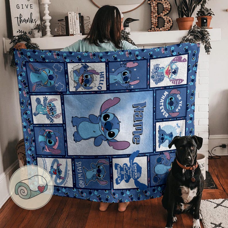 May include: A blue blanket featuring the character Stitch from Lilo & Stitch. The blanket has a central image of Stitch with the name "Name" and smaller images of Stitch with text like "Hello" and "Stay Weird".