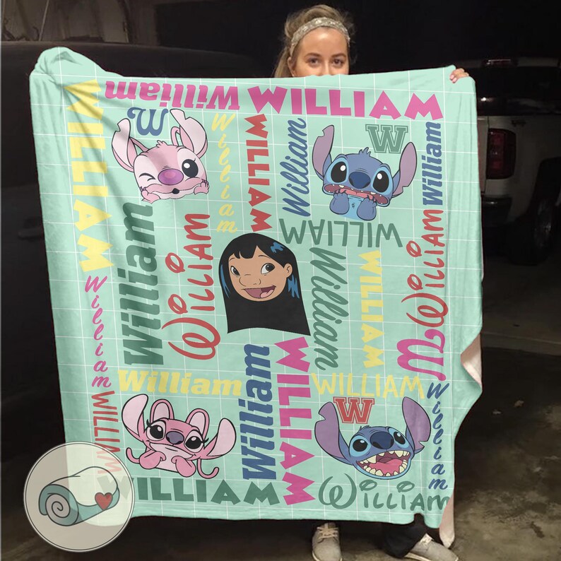 May include: A light blue blanket featuring cartoon characters and the name "William" in various colors. The blanket has a grid pattern and includes images of Stitch and Lilo.