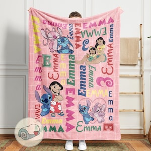 May include: Pink fleece blanket featuring cartoon characters and the name "Emma" in various colors and fonts. The blanket has a grid pattern and includes images of Stitch and Lilo.