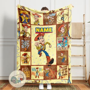 May include: A yellow blanket featuring a cartoon cowboy character in various poses. The blanket has a repeating pattern of the character and text, including "SHERIFF", "NAME", and "Giddy Partner". The blanket is approximately 60 inches wide and 80 inches long.