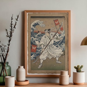 May include: Framed Japanese-style print featuring a warrior in white attire, wielding a spear-like weapon, set against a backdrop of a large ocean wave. Two red flags with butterfly emblems are visible. The artwork is in a wooden frame.