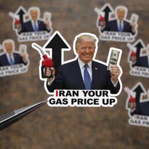 May include: Stickers featuring a smiling man in a suit holding a gas pump and a hundred-dollar bill. The text "Iran Your Gas Price Up" is below the image. Other stickers with the same design are in the background.