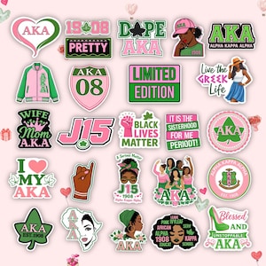 May include: A collection of stickers with pink and green designs. The stickers feature text such as "AKA," "Black Lives Matter," and "Limited Edition." Some stickers include illustrations of women, hearts, and a high-heeled shoe.