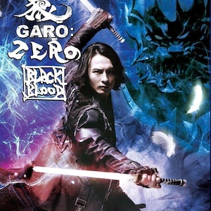 May include: DVD cover for "GARO: ZERO BLACK BLOOD" featuring a man wielding two glowing swords. The title is in white and the background is a dark blue with abstract designs. The text "VOL.1-6 END" is in a gold oval.