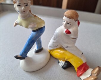Teen boy on phone figurine, teenager girl figurine, Japan, 1960s.