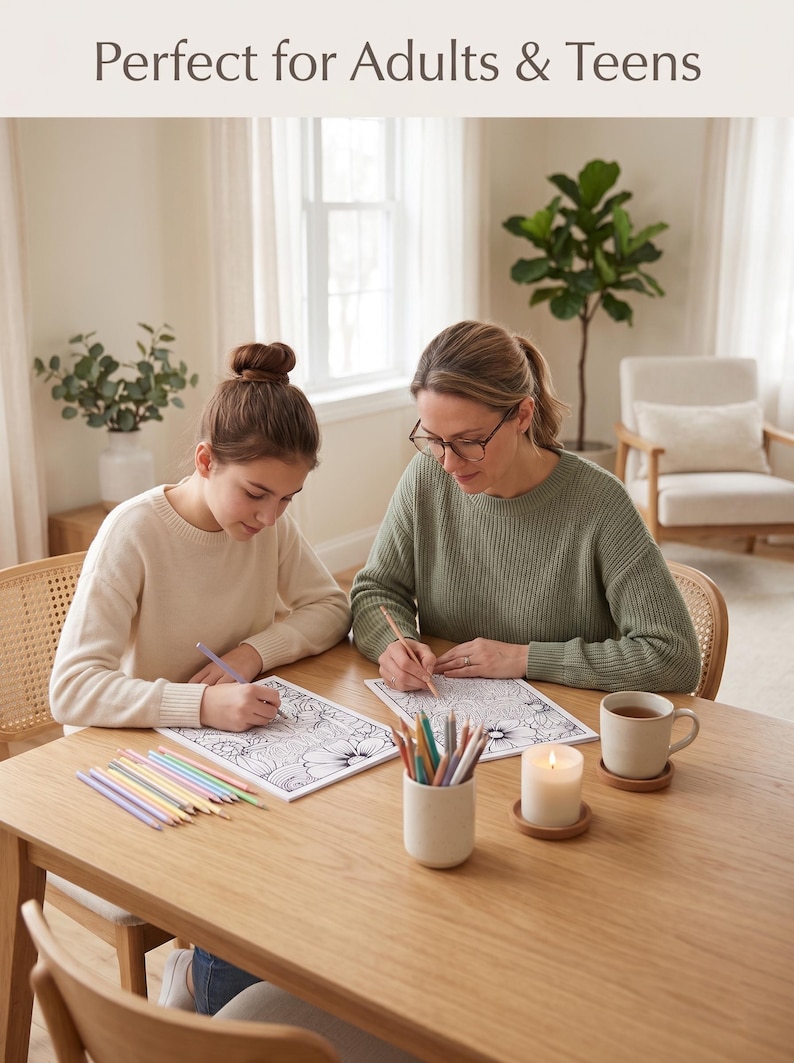 May include: Two people are coloring intricate floral designs on paper at a wooden table. Colored pencils, a candle, and a cup of tea are also on the table. The text "Perfect for Adults & Teens" is at the top of the image.