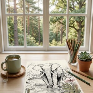 May include: A colouring page depicting an elephant in a natural environment, with the text "Relax with Nature Coloring." The scene includes a cup of tea, coloured pencils, and a small succulent plant. The image is set on a wooden table near a window.