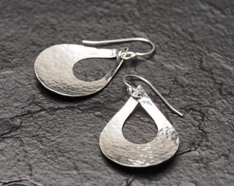 hammered medium sized sterling silver teardrop with teardrop shaped cutout dangly earrings, ildiko jewelry, minimalist jewelry