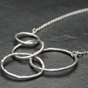generations of love hammered sterling silver four intertwined circles necklace, ildiko jewelry, minimalist jewelry