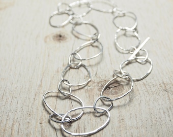 hammered sterling silver long chain necklace with alternating small and large irregular oval links, ildiko jewelry