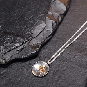 flame hued tourmaline inside hammered sterling silver solid circle on short chain necklace, ildiko jewelry, minimalist jewelry