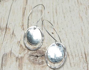 hammered sterling silver oval drop earrings, domed oval and oval outline off long sleek hooks, ildiko jewelry, minimalist jewelry