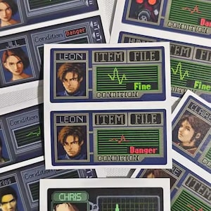 May include: A collection of rectangular stickers featuring character portraits and digital display graphics. The stickers include names like Jill, Leon, and Chris, with text such as "Item File" and "Condition". The color palette includes blues, greens, and white.