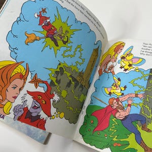 May include: A vintage comic book illustration featuring characters in a fantasy setting. The artwork depicts a witch on a broom, a superhero, and other figures in action. The color palette includes blues, reds, and yellows, with text bubbles and text on the page.
