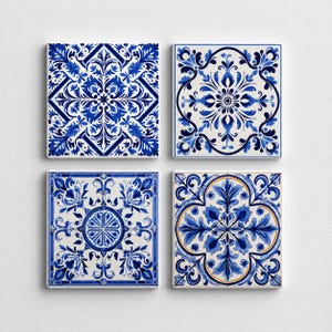 May include: A set of four square ceramic tiles featuring intricate blue and white floral and geometric patterns. Each tile displays a unique symmetrical design with varying arrangements of leaves, petals, and scrollwork in shades of cobalt blue.