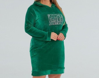 May include: A green hooded dress with long sleeves. The dress features the text "JUICY LOVES COUTURE" in rhinestones on the chest. The dress is made of a soft, velvet-like material.
