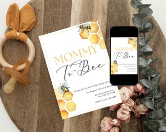 May include: A white and gold baby shower invitation with a bee and honeycomb design. The invitation reads "Mommy To Bee" and includes details for the event, such as the date, time, and location. RSVP information is also included.