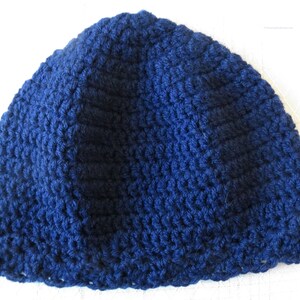 May include: A dark blue crocheted beanie hat.