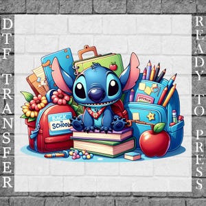May include: A DTF transfer ready to press featuring a blue alien character sitting on stacked books between a red backpack with a Back to School sign and a blue backpack filled with pencils, with a red apple and flowers in the foreground.