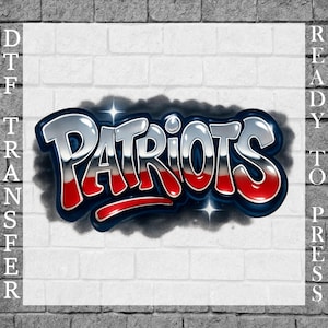 May include: A DTF (Direct to Film) transfer design featuring the word "Patriots" in a graffiti style. The word is in silver with red accents and a dark blue outline, set against a white brick background. The words "Ready to Press" are on the right side.