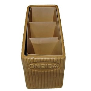 May include: A tan ceramic utensil holder with three interior compartments. The exterior features a bamboo-like texture and the word "ONEIDA" is embossed on the front. The holder is rectangular and has a slightly flared top.