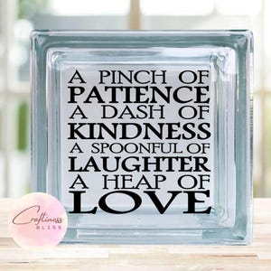 May include: A clear glass block with the words "A Pinch of Patience, A Dash of Kindness, A Spoonful of Laughter, A Heap of Love" in black lettering. The Craftiness Bliss logo is in the lower left corner.