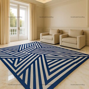 May include: A geometric rug with a navy blue and cream striped design. The rug's modern pattern features intersecting lines, creating a striking visual effect. The rug is in a room with neutral walls and furniture, creating a stylish interior.
