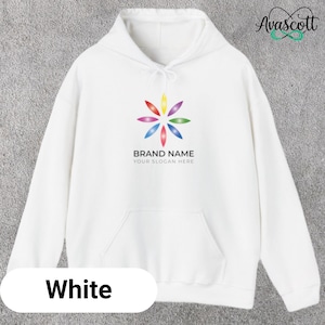 May include: White hoodie with a front pocket and a drawstring hood. The hoodie features a colorful floral logo with the text "BRAND NAME" and "YOUR SLOGAN HERE". The word "White" is displayed at the bottom.
