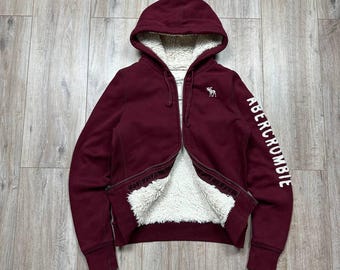 Sudadera con capucha y cremallera completa forrada de piel sintética estilo años 2000 de Abercrombie Fitch, color rojo, talla L para mujer.