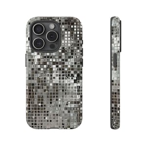 May include: A silver and gray phone case with a mosaic tile design. The case has a hard shell and covers the back and sides of the phone. The camera lenses are visible on the back. The case is shown from the front and side.