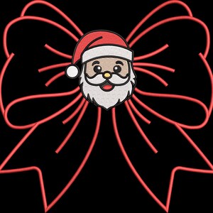 May include: Embroidered Christmas bow with a Santa Claus face in the center. The bow is red, and the Santa has a white beard and hat with a red trim. The background is black.