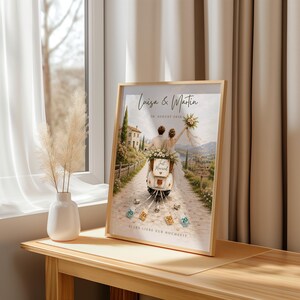 May include: A framed print featuring an illustration of a couple on a scooter with the text Luisa & Martin, 20. AUGUST 2026, Just Married, Happily Ever After, and ALLES LIEBE ZUR HOCHZEIT. The scene shows a path, a building, and currency notes.