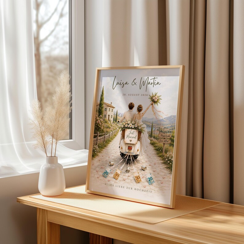 May include: A framed print featuring an illustration of a couple on a scooter with the text Luisa & Martin, 20. AUGUST 2026, Just Married, Happily Ever After, and ALLES LIEBE ZUR HOCHZEIT. The scene shows a path, a building, and currency notes.