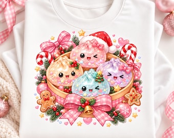 May include: A white sweatshirt featuring a graphic of four smiling, glittery dumplings in a bamboo steamer. The illustration includes a Santa hat, candy canes, a gingerbread man, pink bows, holly, and small stars, all arranged in a festive holiday theme.