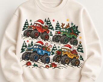 May include: A cream-colored crewneck sweatshirt featuring a graphic print of four monster trucks in red, green, blue, and yellow. The trucks are decorated with Santa hats, reindeer antlers, Christmas trees, gifts, and candy canes.