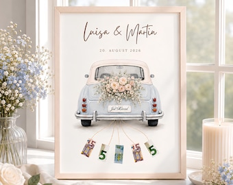 May include: A framed print featuring a light blue vintage car with a floral arrangement on the trunk, the text Luisa & Martin, 20. AUGUST 2026, and a Just Married license plate. Five euro banknotes hang from the rear bumper by thin strings.