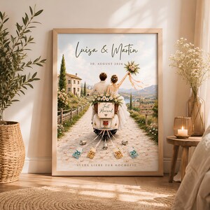 May include: A framed wall art print featuring a couple on a scooter with the text Luisa & Martin, 20. AUGUST 2026, Just Married, and ALLES LIEBE ZUR HOCHZEIT. The scene shows a stone path, a villa, and currency notes tied to the back of the scooter.