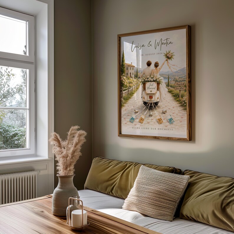 May include: A framed wall art print featuring a couple on a scooter with the text Luiza & Martin, 20. AUGUST 2024, Just Married, and ALLES LIEBE ZUR HOCHZEIT. The illustration shows a scenic path, a stone building, and hanging currency notes.
