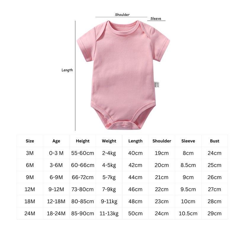 May include: A solid light pink short-sleeve baby bodysuit with a crew neckline and snap closures at the bottom. The image includes a sizing chart with columns for age, height, weight, length, shoulder, sleeve, and bust measurements in cm and kg.