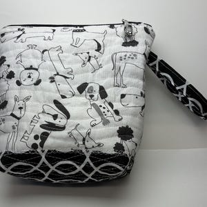 May include: A set of three ceramic mugs with a speckled, matte finish. The mugs are in shades of cream, light gray, and dark gray. Each mug has a simple, minimalist design and a rounded handle.