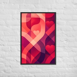 Puede incluir: Impresión artística abstracta enmarcada. La obra presenta un diseño geométrico con formas superpuestas en tonos de rojo, rosa y morado. Tres corazones rojos son visibles dentro del diseño. La impresión está montada en una pared de ladrillo blanco.