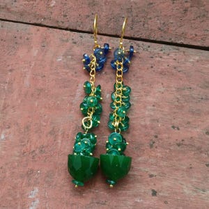 May include: A set of three ceramic mugs with a speckled, matte finish. The mugs are in shades of cream, light gray, and dark gray. Each mug has a simple, minimalist design, perfect for coffee or tea.