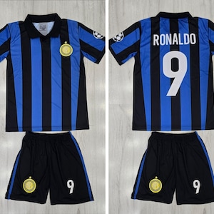 May include: A blue and black striped soccer jersey and shorts set. The jersey has a black collar and the name "RONALDO" and the number "9" on the back. The shorts are black with a white number "9".