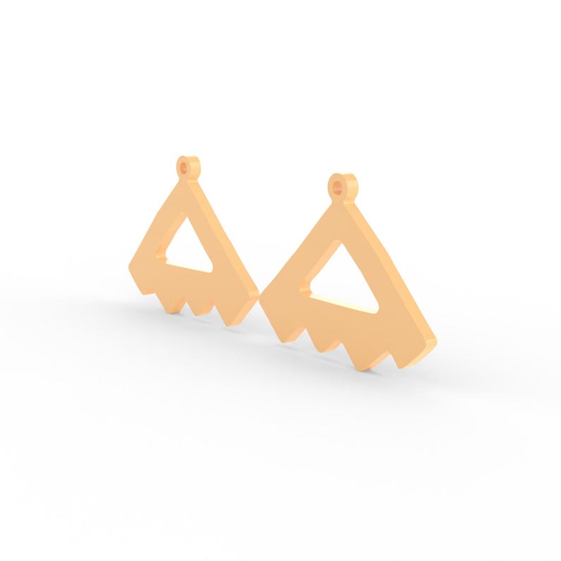 May include: Two peach-colored earrings. Each earring has a triangular shape with a smaller triangle cut out in the center. The bottom edge of each earring has a zig-zag pattern. A small loop is at the top of each earring.