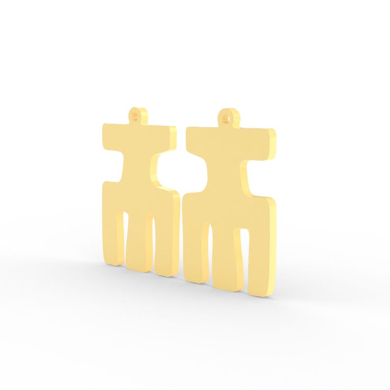 May include: Two gold-colored abstract earrings with a unique, stylized design. Each earring features a top loop for hanging, a horizontal bar, and three vertical bars extending downwards. The earrings are set against a white background.